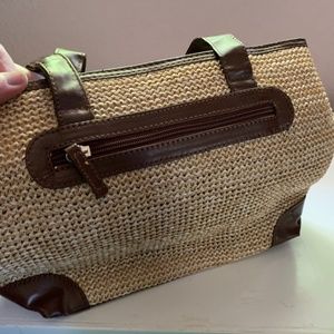 Straw handbag trimmed in brown leather like